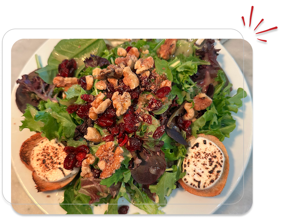 Salad with goat cheese, walnuts, and cranberries.
